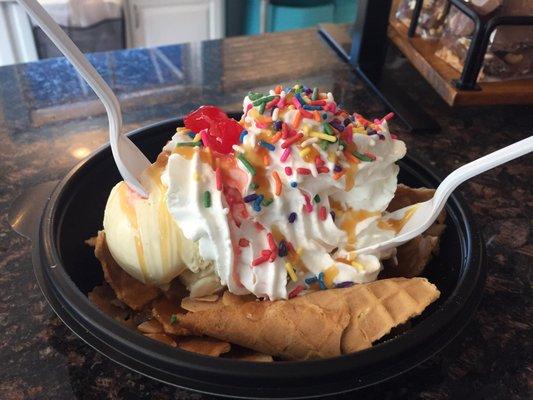 Ice Cream Nachos (made with crushed waffle cones as chips, scoops of ice cream, carmel, almonds & sprinkles)