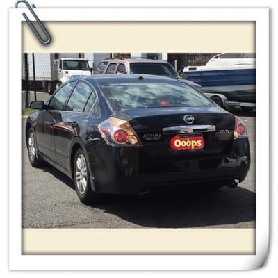 Car being backed into shop to get tinted.