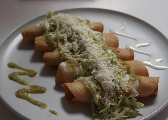 ORDER OF 5 ROLL UP TAQUITOS PREPARED WITH LETTUCE, SOUR CREAM, COTIJA CHEESE, CHOICE OF SAUCE