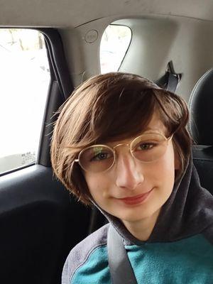 My other son loving his new glasses.