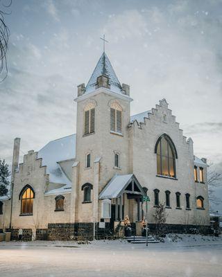 A wintery photo of Lumen Hall in the snow.