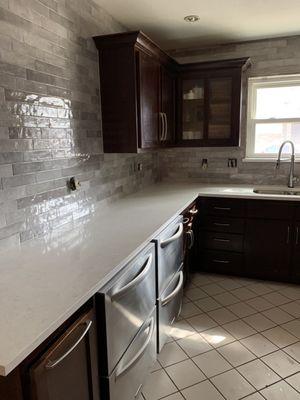 After picture with new counter, to the ceiling back splash