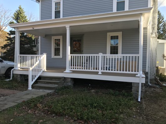 Porch rennovation: Paint, new decking, columns, railing, fascia.