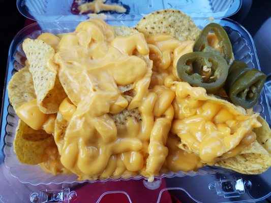 Yummy nachos with cheese sauce.