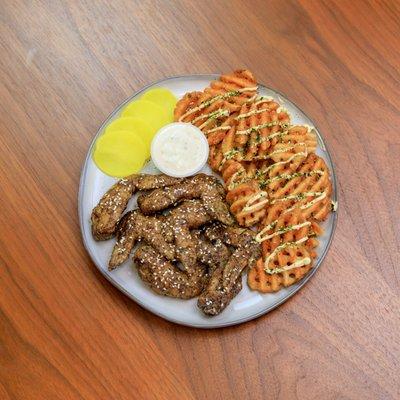 peppery Japanese tebasaki-inspired chicken wings, waffle fries with kewpie mayo and furikake, pickled daikon, and creamy ranch