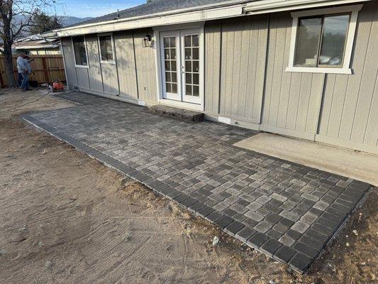 Battle Born Lanscaping placed the pavers in an attractive pattern with a nice perimeter, and also constructed a step for our French doors.