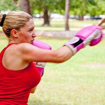 Women learn boxing for self-defense.