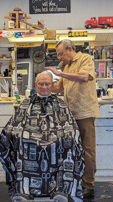 Leroy (Owner/Barber) Giving Charlie a fresh Clean Cut.