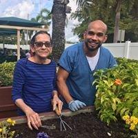 A sunny day enjoying some gardening with a member of staff.