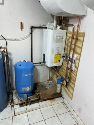 Freshly installed well tank and Navien tankless hot water heater