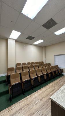 Our classroom, it has 25 stadium chairs, a tv, and a large whiteboard for team meetings!