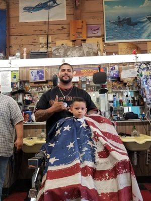 My little one and his own barber Miguel.  Good guy and got my kids stamp of approval.