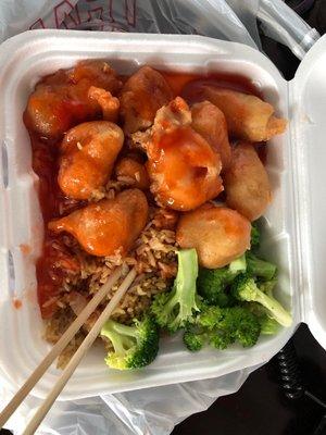 Sweet and sour chicken, steamed broccoli on rice.