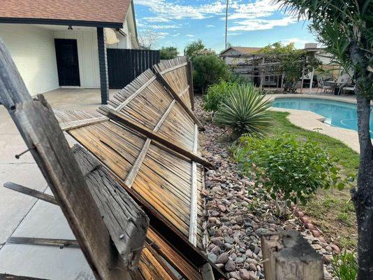 Storm Damage Wood Fence in Phoenix, Az.  Fence Teardown and Junk Removal with Junk Mania