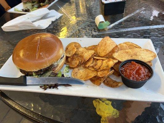 A classic cheeseburger with homemade chips