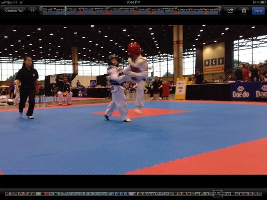 Marcus throwing jump back kick at Nationals Championships