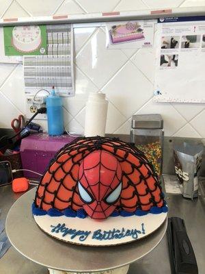 Spider-man ice cream cake including the deco toy with light up eyes for a customer cake order.