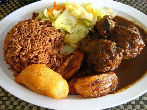 Brown Stewed Chicken with Rice and Red Peas and Steamed Cabbage.