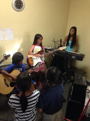 Our music students enjoy playing with their own Rock Band.