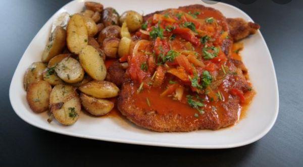 Zigeunerschnitzel (Gipsy Schnitzel) with a tasty pepper sauce ( not spicy) and roasted potatoes