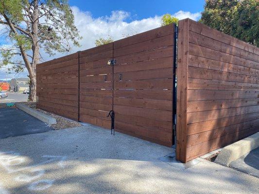 Metal fabricated trash enclosure with Con Heart Redwood cladding