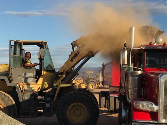 Crews in Indio loading a truck with material