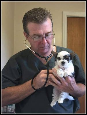 Dr. Turner taking care of another precious puppy!