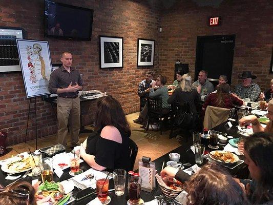 Dr. Ben educating guests at our Dinner with the Doc