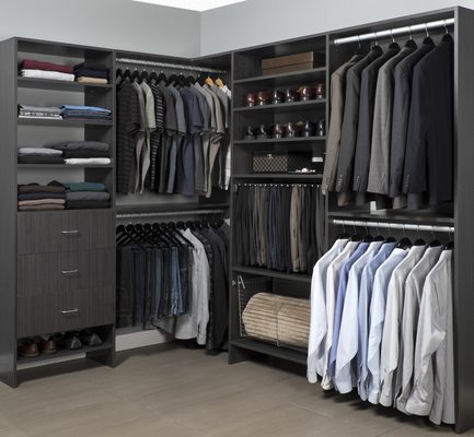 Custom Closet in licorice with hanging, shelving, and drawers with flat fronts.