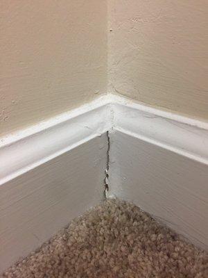 Every room has corners like this. They love white caulk and love to smash it into place with their fingers.