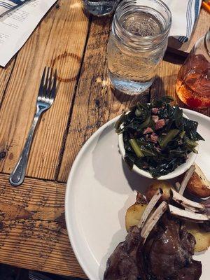 Bourbon glazed lamb with collard greens and potatoes.