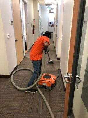 Emergency Water Extraction from carpeted floor - Commercial Water Damage