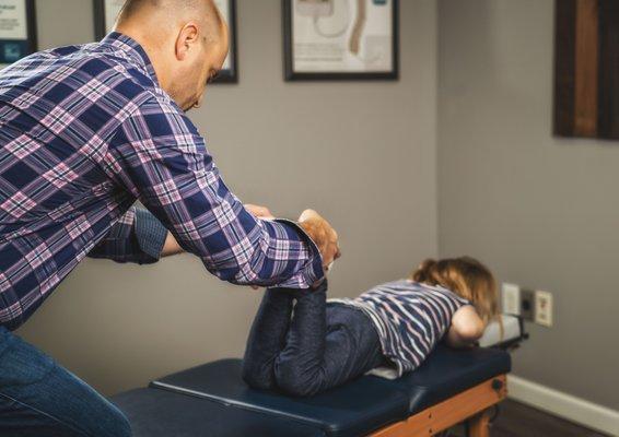 A common leg length check for pelvis alignment performed on a child is the same way as an adult.