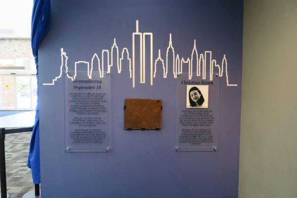 The 9/11 Memorial Wall in the lobby features a piece of steel from the World Trade Center and a tribute to WHS graduate Christina Ryook.