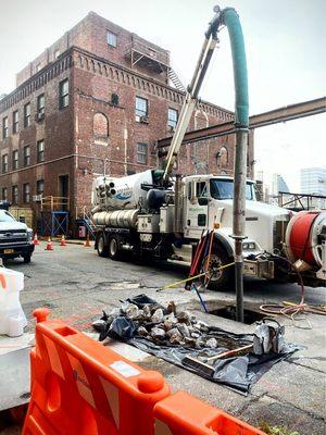 Vactor truck cleaning out a storm drain system