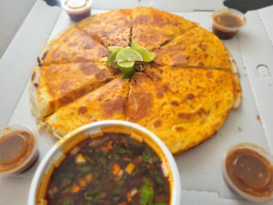 14" Birria pizzadilla comes with a 16oz consome broth