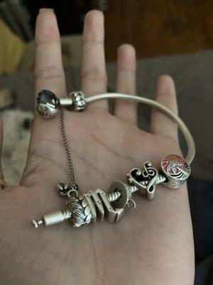 Broken koi fish charm and charm bracelet with faulty clasp