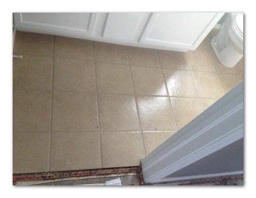 This tile floor was cleaned and the grout lines were sealed to a lighter color.