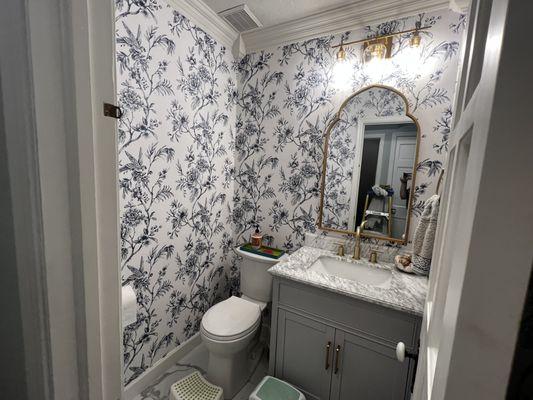 Consider using wallpaper in you bathroom for a classic elegant look.