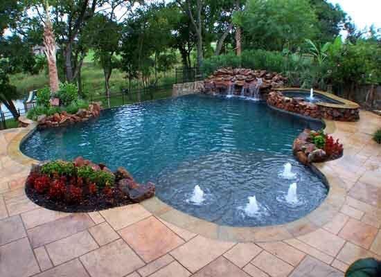 Custom Pool with spa and weeping wall.