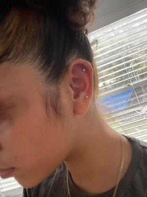 She made my ear turn purple. Someone give this girl some training cuz I could have done this at home without making myself bleed.