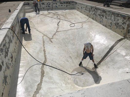 Grinding and sanding pool floor