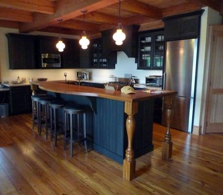 Reclaimed antique heart pine timbers and flooring installed in a lakeside cottage in Vermont.