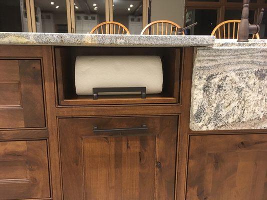 Accessible paper towel holder in a base cabinet.