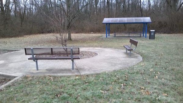 single shelter with some benches & picnic tables, but no grill