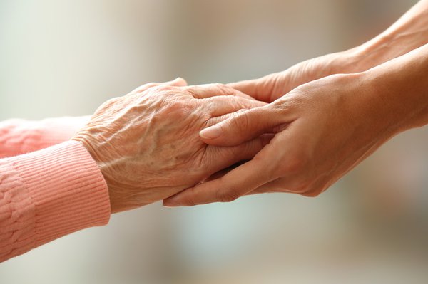 Caregiver Holding the Hands of a Senior