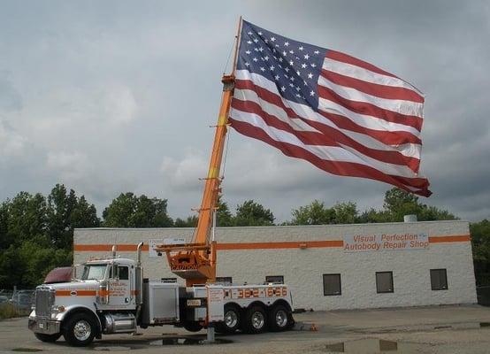 Our rotator wrecker on the Fourth of July with the American flag