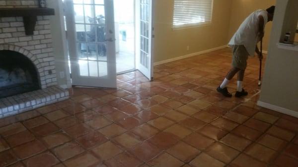 Mike starting the cleaning process on my Saltillo tile and grout.