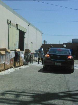 Drive in, open your trunk. The employee will take out the hazardous wastes.