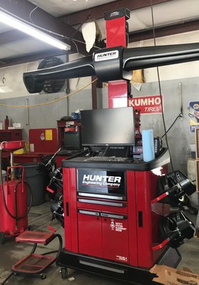 Four wheel alignment, computerized with attachments for all foreign vehicles.